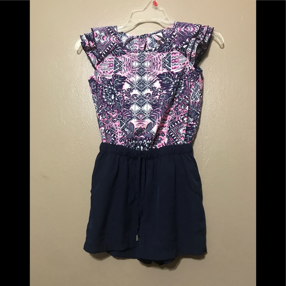 A pink, blue, and white romper from Justice